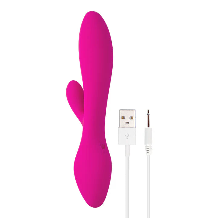 Vibrador Softs en vista lateral junto al cable USB para carga, destacando su forma curva y estimulador clitorial.