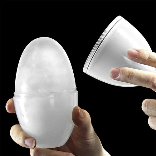 Masturbador masculino Giant Egg Stamina Nodules estirado para demostrar su flexibilidad y elasticidad, en color blanco translúcido.